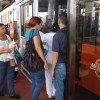 Patrons board a Metro Bus in Panama which are modern and air conditioned.