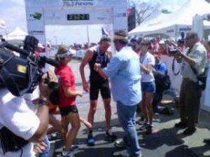 Panama Ironman winner 2012 is congratulated at the finish line.